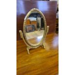 Small gilt framed decorative table mirror.