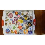 A tray lot of vintage lapel and enamel badges.