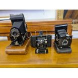Vintage Kodak folding Brownie SIX-20 camera, Vest Pocket Autographic folding camera and an ICA