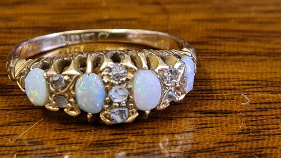18ct gold 4 stone opal ring with 7 small inset diamonds, UK size L.