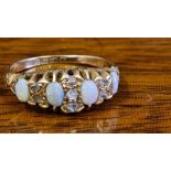 18ct gold 4 stone opal ring with 7 small inset diamonds, UK size L.