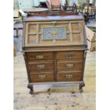 Late Victorian Thomson's patent walnut bureau with carved and panelled fall and 6 drawers upon short