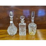 3 cut glass spirit decanters.