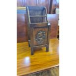 1930's oak stick stand with galleon carved panel.