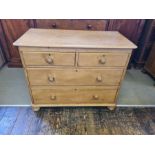 Victorian 4 drawer stripped pine chest on bun feet, 103cm wide x 81cm high x 51cm deep.