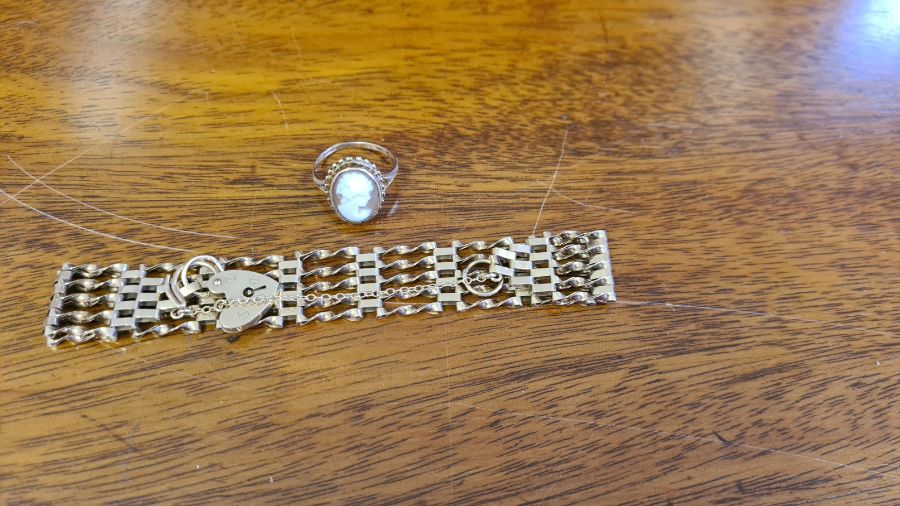 9ct gold padlock and gate bracelet, 12g together with a 9ct cameo ring.