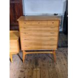 A mid century Alfred Cox for Heals walnut bedroom chest and matching dressing table.