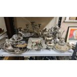 Large lot of plated wares to include teasets, candelabra, cake baskets, trays, silver back brush,