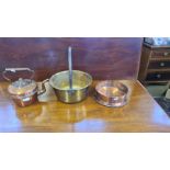 An early 20th century copper kettle, Victorian brass preserve pan and a copper holder.