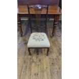 Edwardian nursing chair with woolwork seat with pierced back splat and carved top rail.