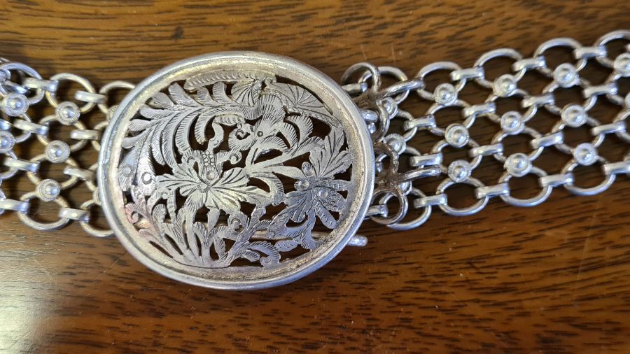 An Asian silver chain belt and cast buckle with pierced oval face 184g. - Image 2 of 3