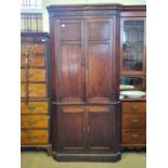 Large 4 door Georgian mahogany floorstanding corner cupboard with panelled doors, shaped internal