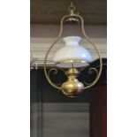 Late Victorian hanging oil lamp with roped and scroll bracket with white opaque mushroom shade.