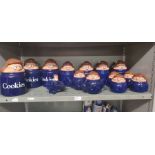 Collection of 14 Tetley tea teapots, storage and cookie jars and a novelty aeroplane money box.