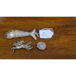An unmarked white metal articulated fish, silver 3 horse brooch and a Victorian silver brooch.