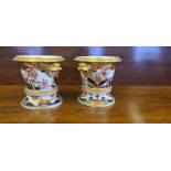 Pair of Spode 967 Imari pattern small jardinieres on stands.