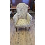 Edwardian strung seated armchair on reeded tapering legs.