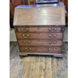 Georgian mahogany fall front bureau with fitted interior with 4 graduated drawers upon ogee