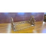 Mid Victorian figured walnut book stand with fret carved decoration.