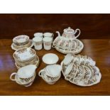 Colclough floral part tea service with teapot, 4 matching coffee cups and a brown and blue Colclough