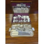 An oak cased canteen of unused Kings pattern cutlery comprising 44 pieces together with a tray of