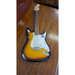 Squier Strat by Fender electric guitar, sunburst colour.