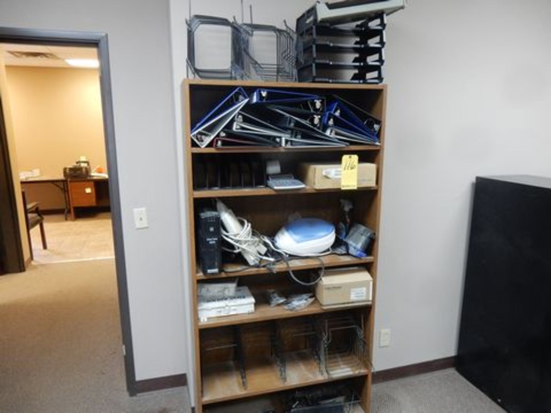 PARTICLE BOARD BOOKSHELF W/CONTENTS TO INCLUDE BINDERS, PAPER TRAYS, BATTERY BACKUPS, OFFICE SUPPLIE