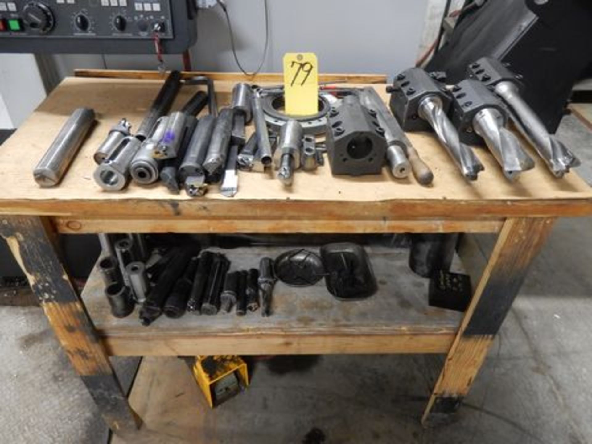 LOT WOOD TABLE W/TOOLING BLOCKS, TOOLING, SLEEVES, ETC.