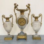 GARNITURE de cheminée en cristal et bronze doré, composée d'une pendule en forme de vase balustre