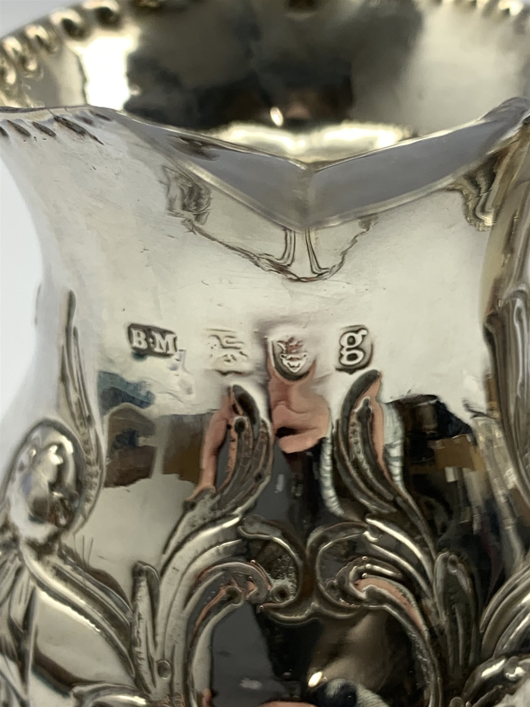 George III silver baluster cream jug embossed with trailing garlands on a pedestal foot London 1782 - Image 3 of 5