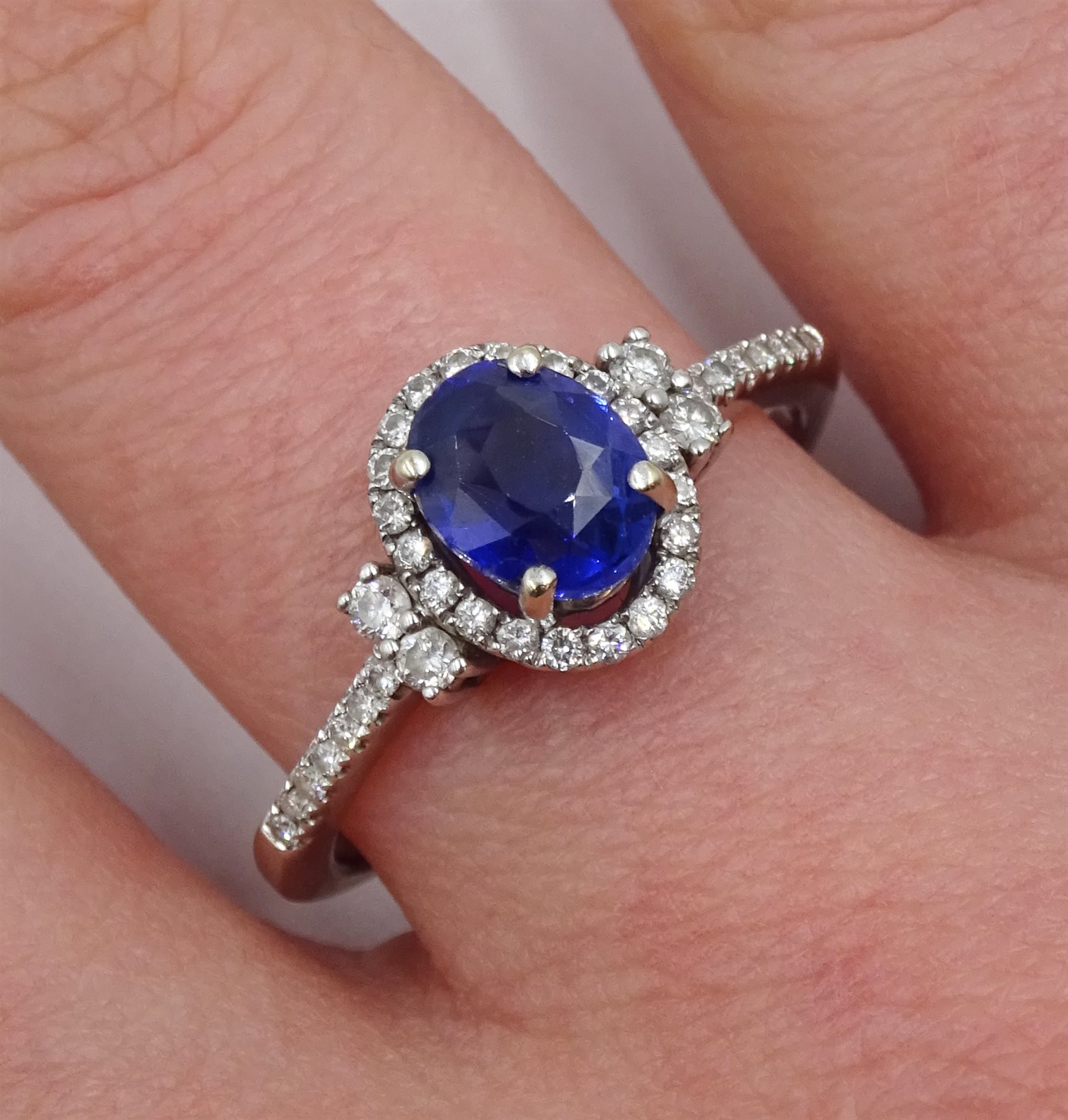 18ct white gold oval sapphire and diamond halo ring, with diamond set shoulders, stamped 750 - Image 2 of 5