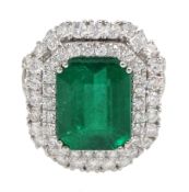 18ct white gold emerald and double halo diamond cluster ring, with diamond set shoulders, hallmarked