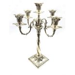 Edwardian silver five light candelabrum of Adam design with scroll branches, the square base cast wi