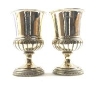 Pair of George III silver goblets, the campana shape bowls with half fluted base on a circular foot
