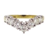 18ct gold seven stone round brilliant cut diamond wishbone ring, London 1997, total diamond weight a