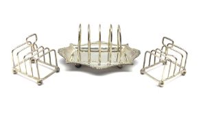 Edwardian silver four division toast rack with integral stand London 1901 Maker William Hutton and a