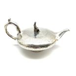 Early Victorian silver tea pot of compressed circular design, the lift formed as a seated Chinese fi