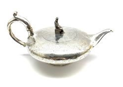 Early Victorian silver tea pot of compressed circular design, the lift formed as a seated Chinese fi