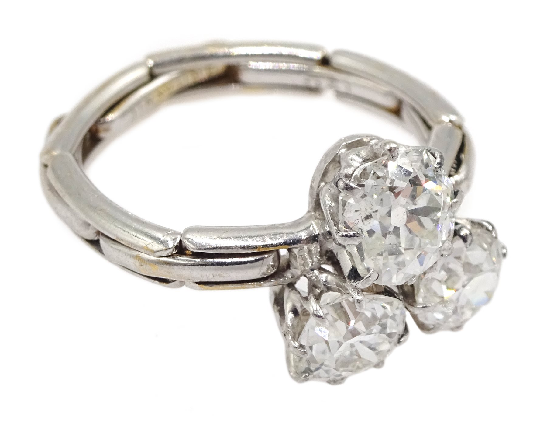 Early 20th century platinum three stone old cut diamond ring, on later 17ct white gold expanding sha - Image 3 of 4