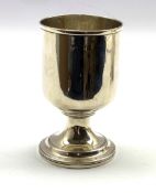 George III silver cup of plain cylindrical form on a pedestal foot H13cm, marks rubbed but London as