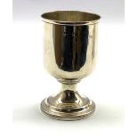 George III silver cup of plain cylindrical form on a pedestal foot H13cm, marks rubbed but London as