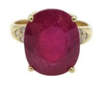 Gold single stone oval ruby ring, with diamond set shoulders stamped 18ct, ruby approx 7.00 carat