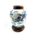 18th century Chinese Provincial blue and white ginger jar decorated with tree and sprays of bamboo a