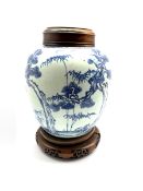 18th century Chinese Provincial blue and white ginger jar decorated with tree and sprays of bamboo a