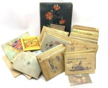 Postcard album containing Edwardian and later examples, many being used with stamps and various ciga