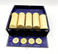 Edwardian blue leather games box containing four Victorian ivory gaming counters each silver inlaid