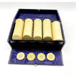 Edwardian blue leather games box containing four Victorian ivory gaming counters each silver inlaid