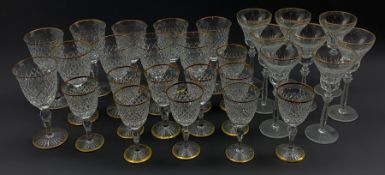 Part suite of Stuart Crystal Hardwicke pattern glasses with gilt rims, comprising ten large claret g