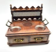 Late Victorian oak smokers stand with pipe and bowl recesses and two small drawers on compressed bun