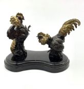 After P J Mene: Pair of bronze fighting cockerels on a marble base H18cm x W26cm
